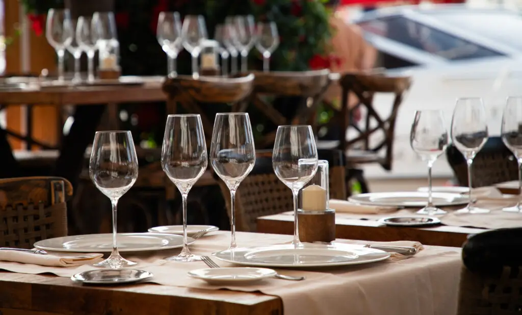 Home 1 Italian Restaurant Santa Rosa — Capriciano Osteria dining room with wine glasses on a candlelit table