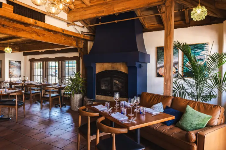 Fireplace seating in the dining room at Capriciano Osteria
