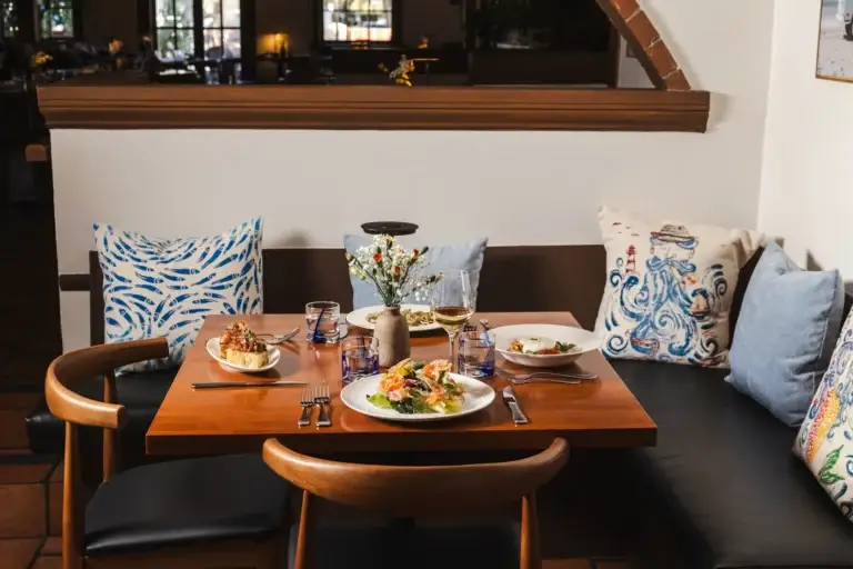 Booth seating in the dining room at Capriciano Osteria