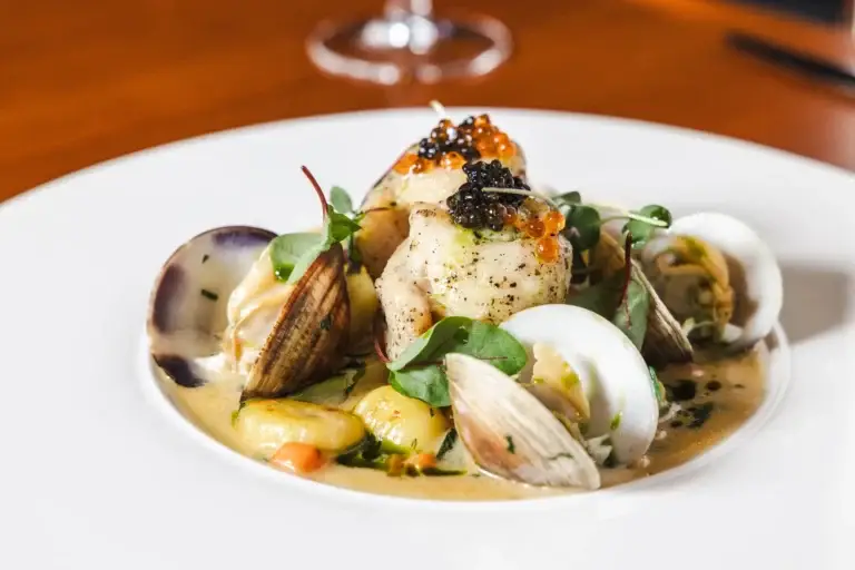 Pesce & Molluschi 2 Fillet of Petrale Sole topped with caviar and roe, with clams and gnocchi, at Capriciano Osteria
