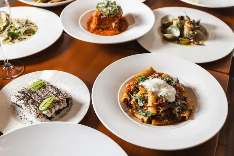 Birthdays & Milestones 4 Shared plates of rigatoni, lasagna, ravioli and a layered dessert with wine at Capriciano Osteria