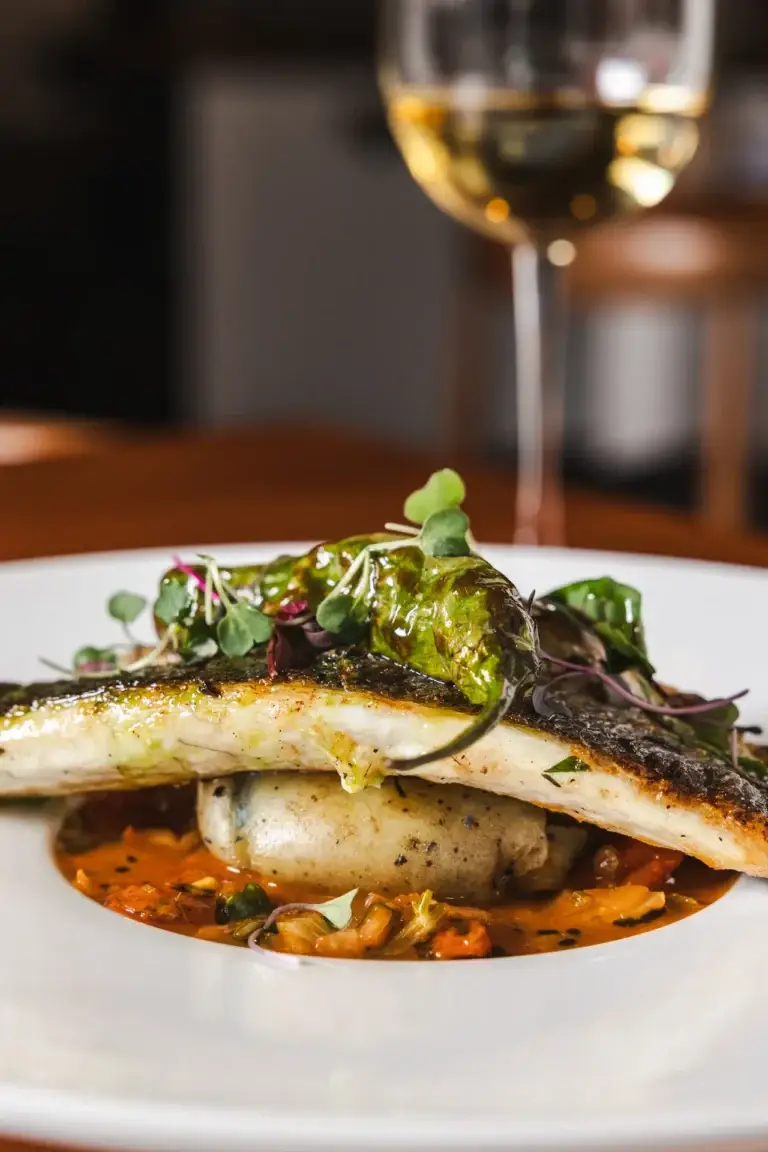 Pesce & Molluschi 1 Sicilian Sea Bass with a shishito pepper over potatoes in tomato broth, fresh seafood in Santa Rosa at Capriciano Osteria